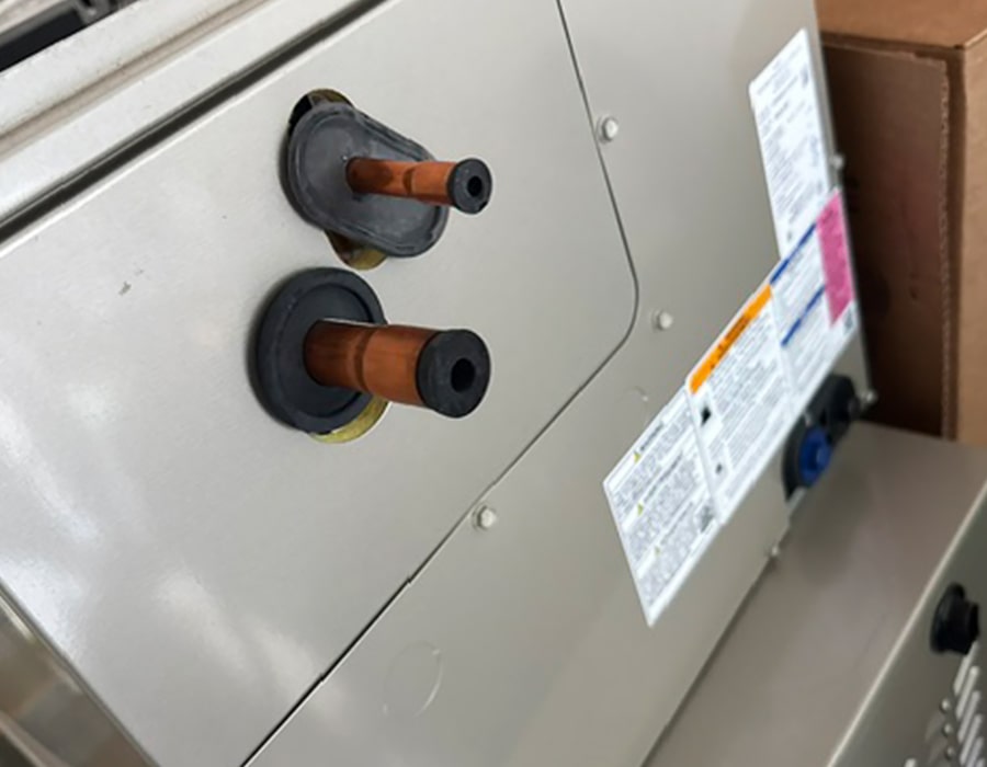 Close-up of residential HVAC unit components during heating and air conditioning repair